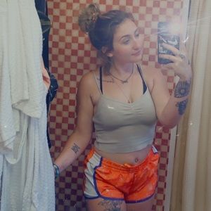 I’m selling the orange gym shorts and the tan tank top.